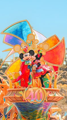 the mickey mouse float is decorated with many colors