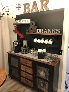 a coffee bar with lots of items on the top and shelves above it that says, coffee & dranks