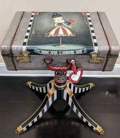 an old suitcase with some decorations on it