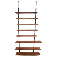 a tall wooden shelf with two black poles on top and three brown shelves below it