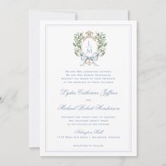 the front and back of a wedding card with an elegant monogrammed wreath on it