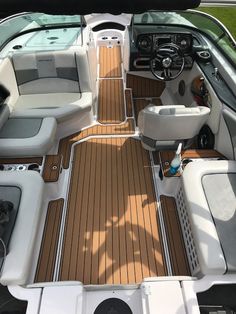 the inside of a boat with wooden flooring