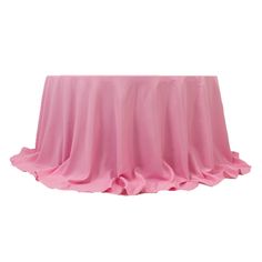 a pink table cloth with ruffles on the top and bottom, in front of a white background