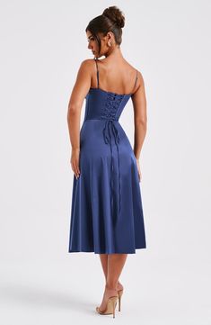 The dreamy Deanna dress is ultra feminine. made in our premium woven cotton blend fabric that feels as good as it looks. Featuring a corseted bodice with boning to cinch the waist. the bust is gathered with a drawstring tie for a super pretty finish. The midi skirt is complete with a thigh high split for a little bit of sexiness. Style it up with an effortless knot and heeled mules.   Colour: Navy. Premium woven cotton blend fabric. Fully lined. Boning in bodice. Gathered. underwired cups. Tie b Homecoming Dresses Corset, Long Sleeve Homecoming Dresses, Maxi Dress Sale, Sparkle Dress, Navy Midi Dress, Dresses By Length, Formal Dresses Prom, Flowy Dress, Prom Party Dresses