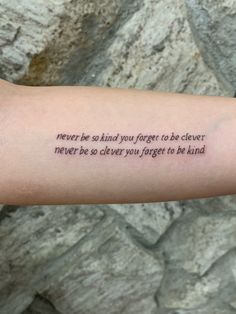 a person's arm with a tattoo saying never be afraid you forget to be clever