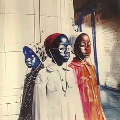 three black women standing in front of a wall with colorful paint on it's face