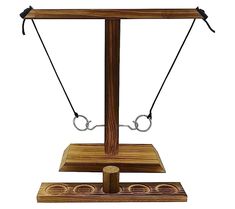 an old fashioned wooden balance scale with two bars on one side and three circles on the other