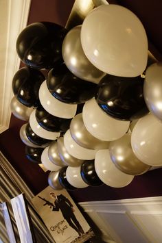 a bunch of balloons hanging from the ceiling