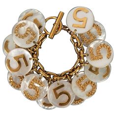 Chanel - Very famous charm bracelet made of bakelite pastilles. Additional information: Dimensions: Length: 22 cm Condition: Very good condition Seller Ref number: BRAB59 Chanel Charm Bracelet, Chanel Charm, Chanel Bracelet, Chanel Jewelry, Arm Candy, Karl Lagerfeld, Bracelet Making, Arm Band, Costume Jewelry