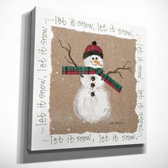 a snowman with a scarf and hat on it's head is shown in front of a white wall