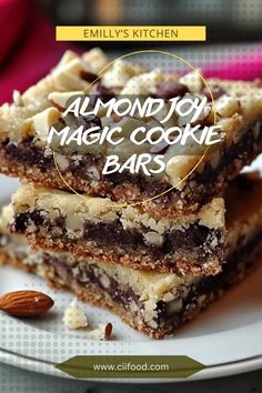 almond joy magic cookie bars are stacked on a white plate with the title above it