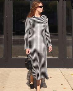 Heading to brunch or a night out, the Seville Striped Sweater Midi Dress delivers a blend of relaxed elegance and trendy flair. This midweight ribbed knit dress wraps you in cozy comfort while making a bold statement with its eye-catching stripes. Pair with sleek boots or stylish sneakers and watch your style game reach new heights. Midweight ribbed knit fabric Pull-on styling Unlined 55% Viscose 27% Polyester 18% Nylon Sleek Boots, Sweater Midi Dress, Relaxed Elegance, Ribbed Knit Dress, Sweater Dress Midi, Dresses By Length, Satin Slip, Dress With Cardigan, Striped Sweater