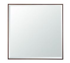 a large mirror is shown on a white surface with brown trimmings and a wooden frame