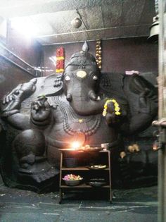 a large statue of an elephant in a room