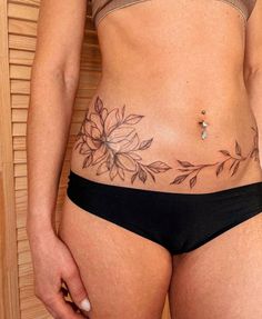 a woman's stomach with flowers on it