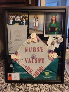 a nurse's cap is surrounded by photos and other items on display in a frame