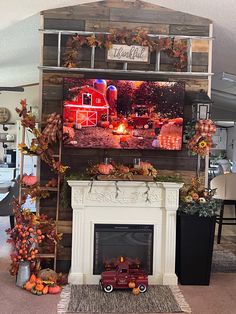 the fireplace is decorated with fall foliage and pumpkins