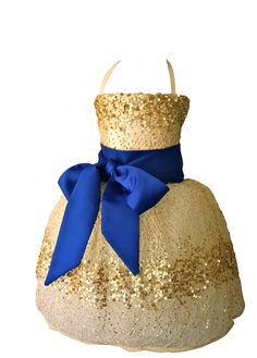 a dress with blue and gold sequins on the skirt is displayed in an instagram