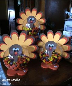 three turkeys with candy in them on a table