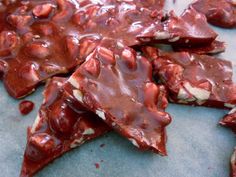 pieces of dark chocolate with white and red toppings