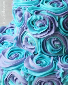 a blue and purple cake with swirls on it