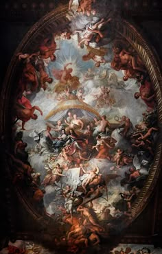 an ornate painting on the ceiling of a building