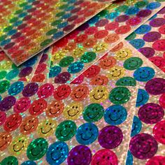 colorful sequinized stickers with smiley faces on them