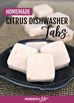 homemade citrus dishwasher tabs on a black plate