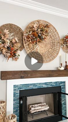 the fireplace is decorated with wicker baskets and fall leaves on it's mantle