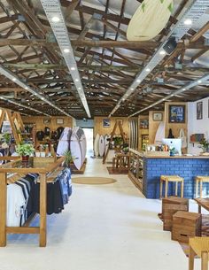 the inside of a store with surfboards on display