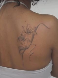 a woman with a tattoo on her back