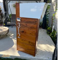 a wooden door with white numbers on it