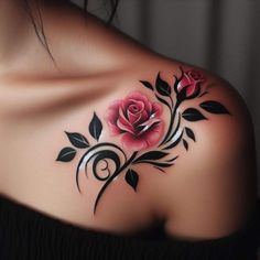 a woman's shoulder with flowers and leaves on it