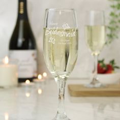 two champagne glasses sitting next to each other on a table