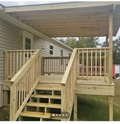 a wooden porch with steps leading up to it