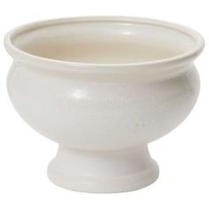 a white bowl sitting on top of a table