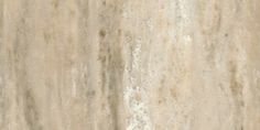 a close up view of the surface of a marble wall with white and beige colors