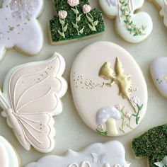 some decorated cookies are laying on a table