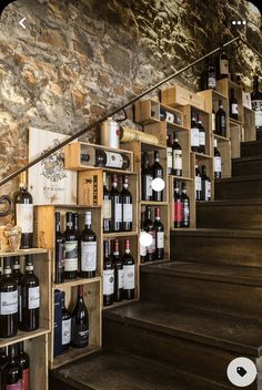 there are many bottles of wine on the stairs