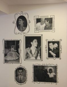 black and white photograph of family photos on the wall