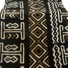 a black and white rug with different designs on it