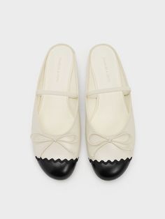 If you are a fan of the demure and dainty ballet flat, you will be glad to know that it is back in the spotlight. This two-toned pair reimagines the classic silhouette with a slip-on construction. Featuring thin straps across the vamps for a secure fit, these versatile cream-and-black shoes are perfect for everyday wear. Scallop-edged black toe caps create striking contrast with the cream uppers -- the delicate bows on the vamps tie it all together. Brand Collaboration, In The Spotlight, Charles Keith, The Cream, The Vamps, Ballet Flat, Classic Silhouette, Trending Shoes, Kid Shoes