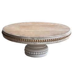 a round wooden table with white pedestals and wood grained finish on the top