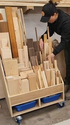 a woman working on woodworking in a shop