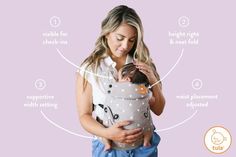 a woman holding a baby in her arms with instructions on how to use the carrier