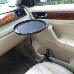 the interior of a car with a tray on it