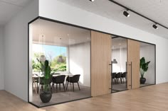 an empty room with glass walls and wooden flooring is seen in this rendering image