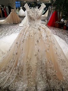 a dress on display in a store with lots of gowns and dresses behind it