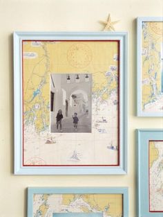 three framed maps are hanging on the wall