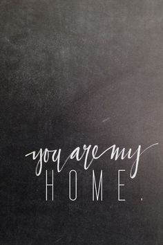 the words you are my home written on a blackboard